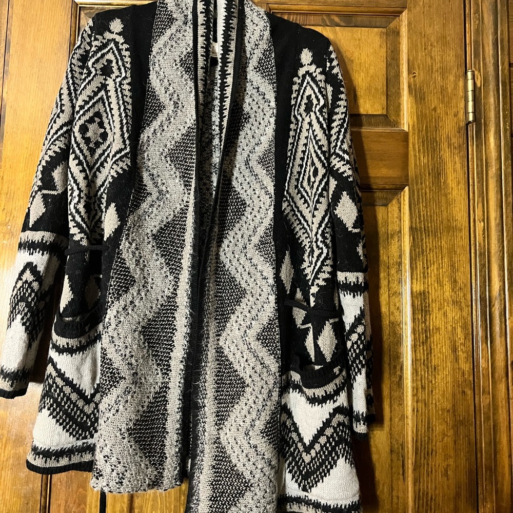 Medium cardigan with beautiful print , very warm . Gently used